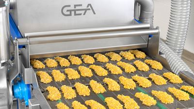 GEA CrumbMaster Gen 2 - crumb coating machine outfeed with cornflake coated products