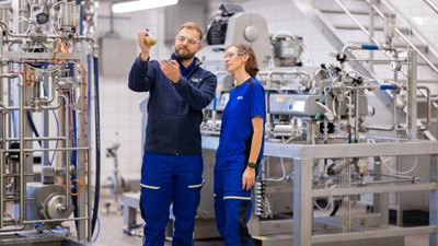 Two persons in the process test center