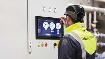 gea-omni-control-panel-being-operated-by-an-industrial-refrigeration-system-technician