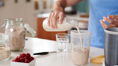  Man Making Shake After Exercise At Home 