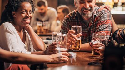 A group of people enjoying a beer