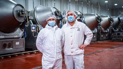 CIAL Chile Employees stand in front of a line of defrosters from GEA.